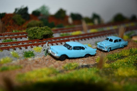 N scale resin cars from the 1950s. Including two 55-57 Chevys and two 51 Chevys